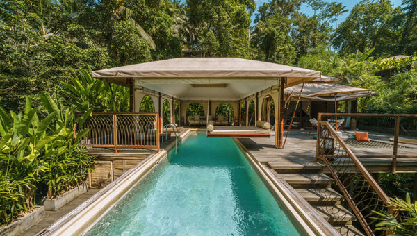 ​K-Club Ubud's Kanva Glamping offers luxury tents with king beds, private jacuzzis or infinity pools, open-air bathrooms, and 24-hour butler service amid Ubud's jungle.
